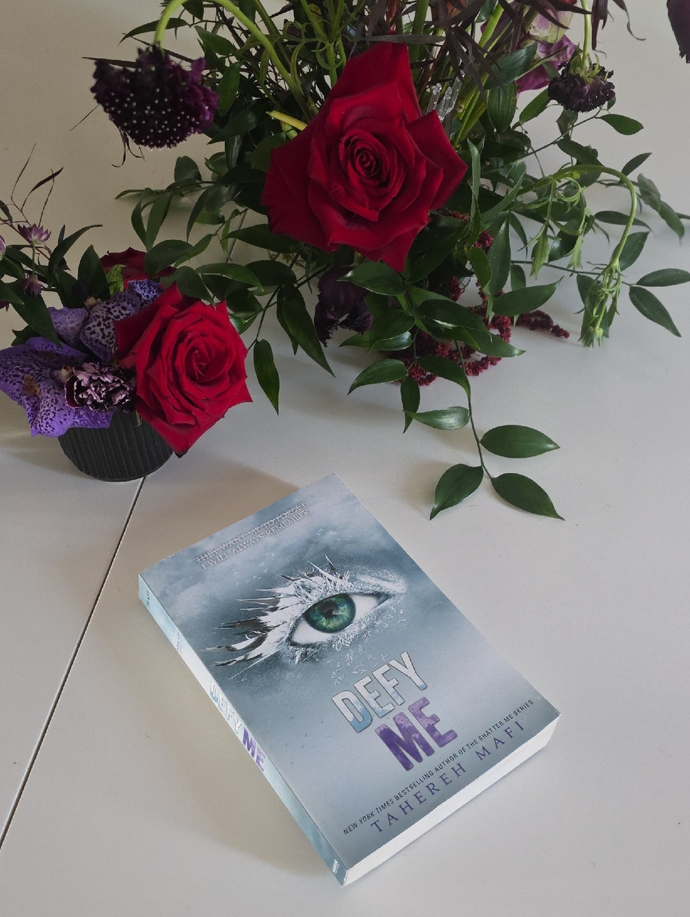 Defy Me by Tahereh Mafi - Blue Paperback with Green Eye Cover